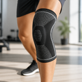 Black knit knee support sleeve worn during light training