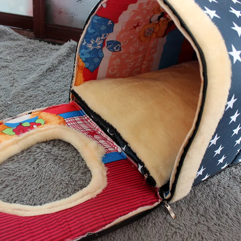 Small dog or cat resting inside a covered pet bed