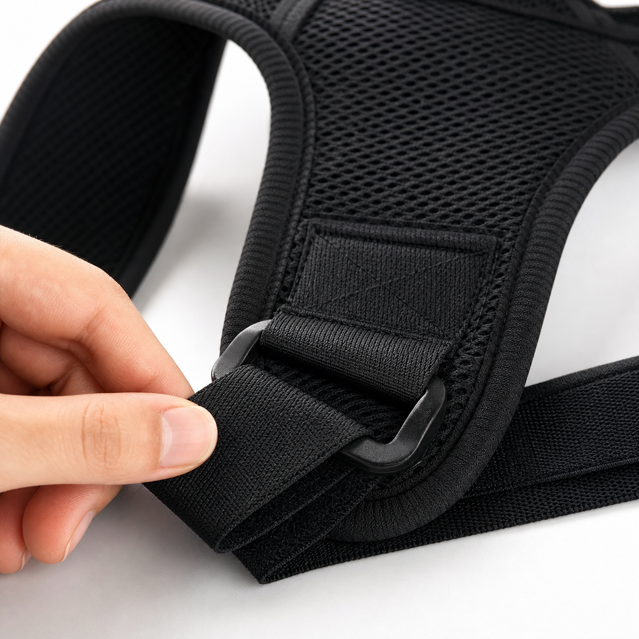 Close-up of adjustable strap and breathable mesh on a posture corrector