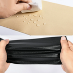 Water droplets on a beige repair sheet and a black sheet flexed by hand