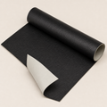 Black Ovnus RestoreRoll leather repair sheet on a clean light background