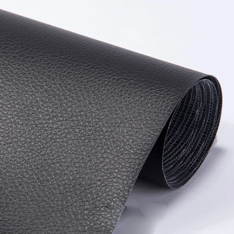 Black rolled self-adhesive repair sheet showing its grained face and woven backing