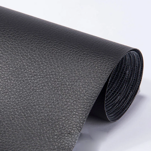 Black rolled self-adhesive repair sheet showing its grained face and woven backing
