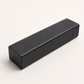 Black Ovnus WeekVault seven-day aluminum organizer on a clean light background