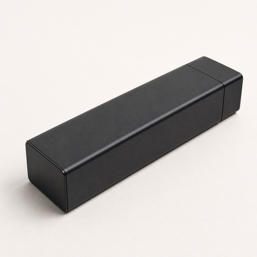 Black Ovnus WeekVault seven-day aluminum organizer on a clean light background